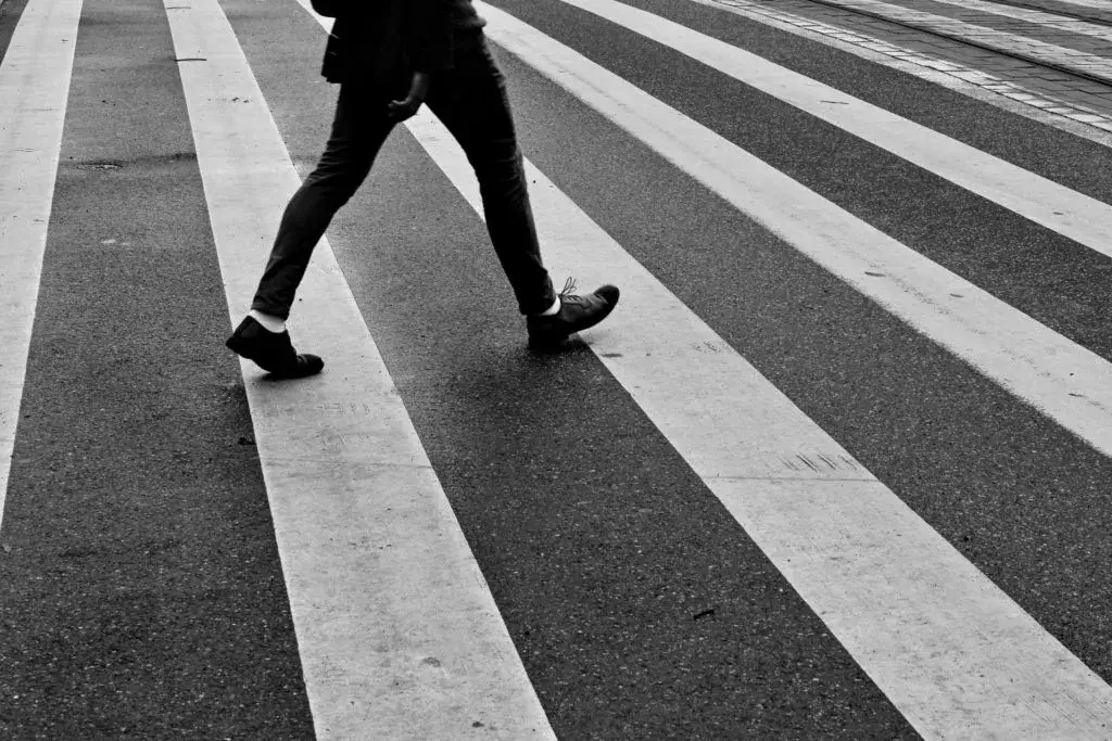 Crosswalk accident with pedestrian. Man with smartphone and